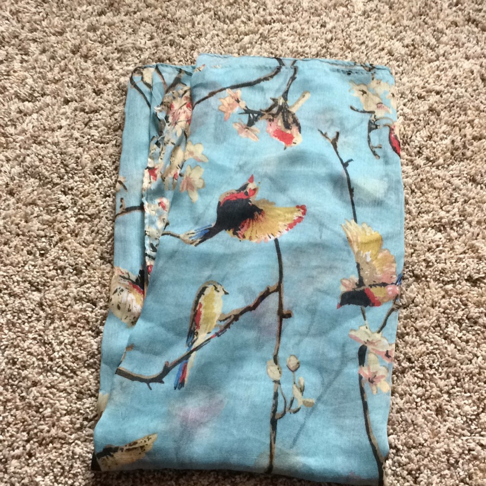 Lightweight scarf with floral/bird design.